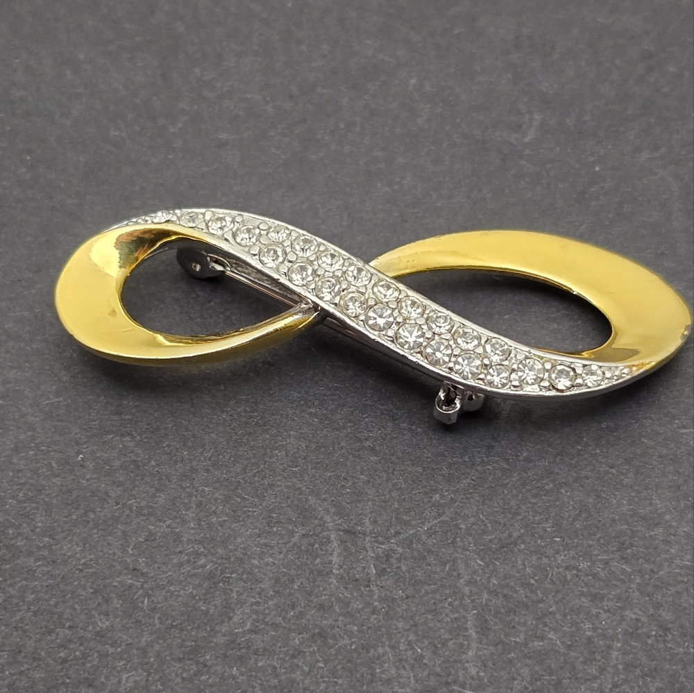 Elegant Gold and Silver Infinity Brooch